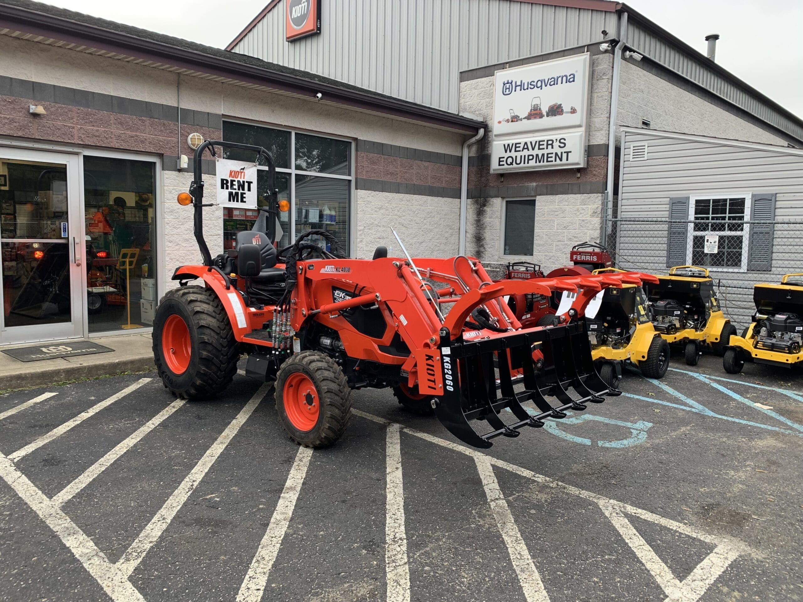 Tractor with Grapple for Rent Weaver's Equipment